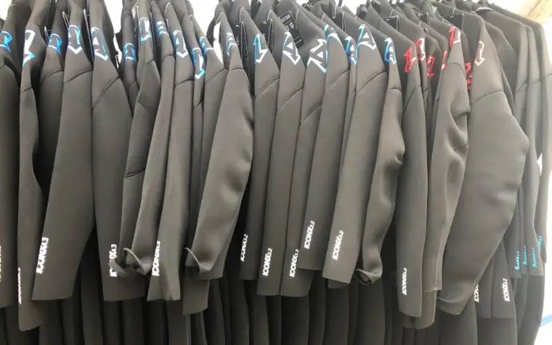 Waves Surf School, Cornwall hire wetsuits on hangers
